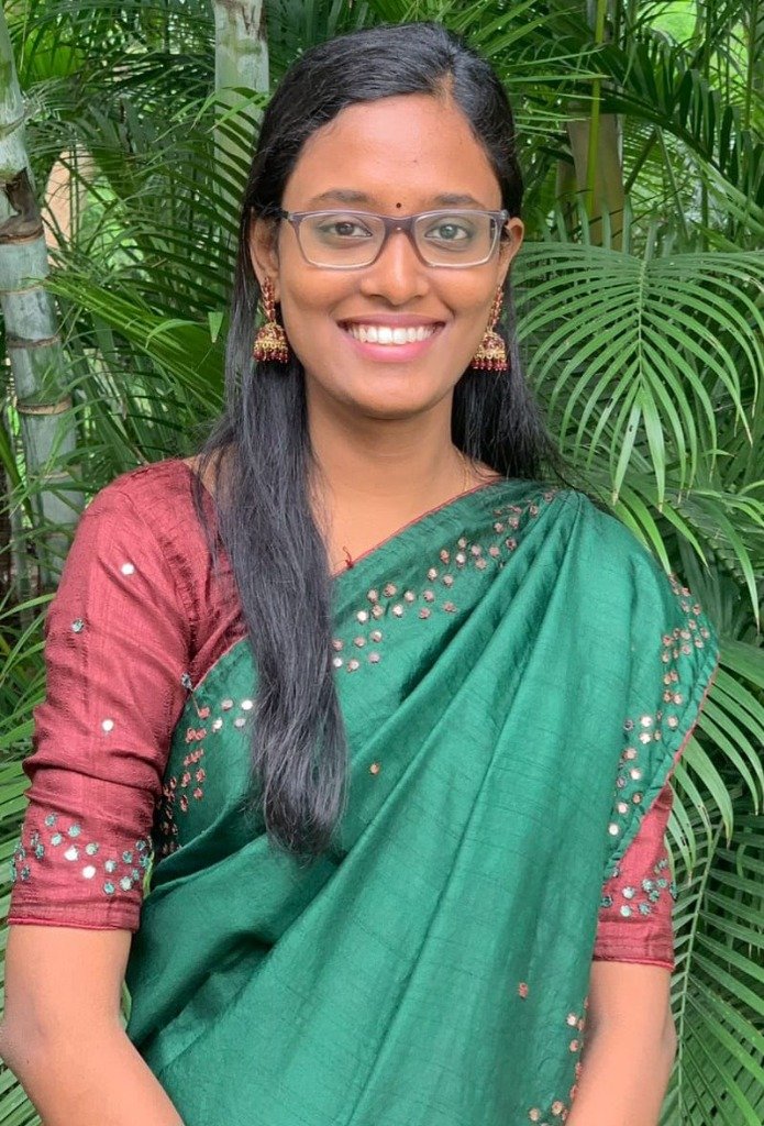 Athira Lipi radiant portrait in emerald saree